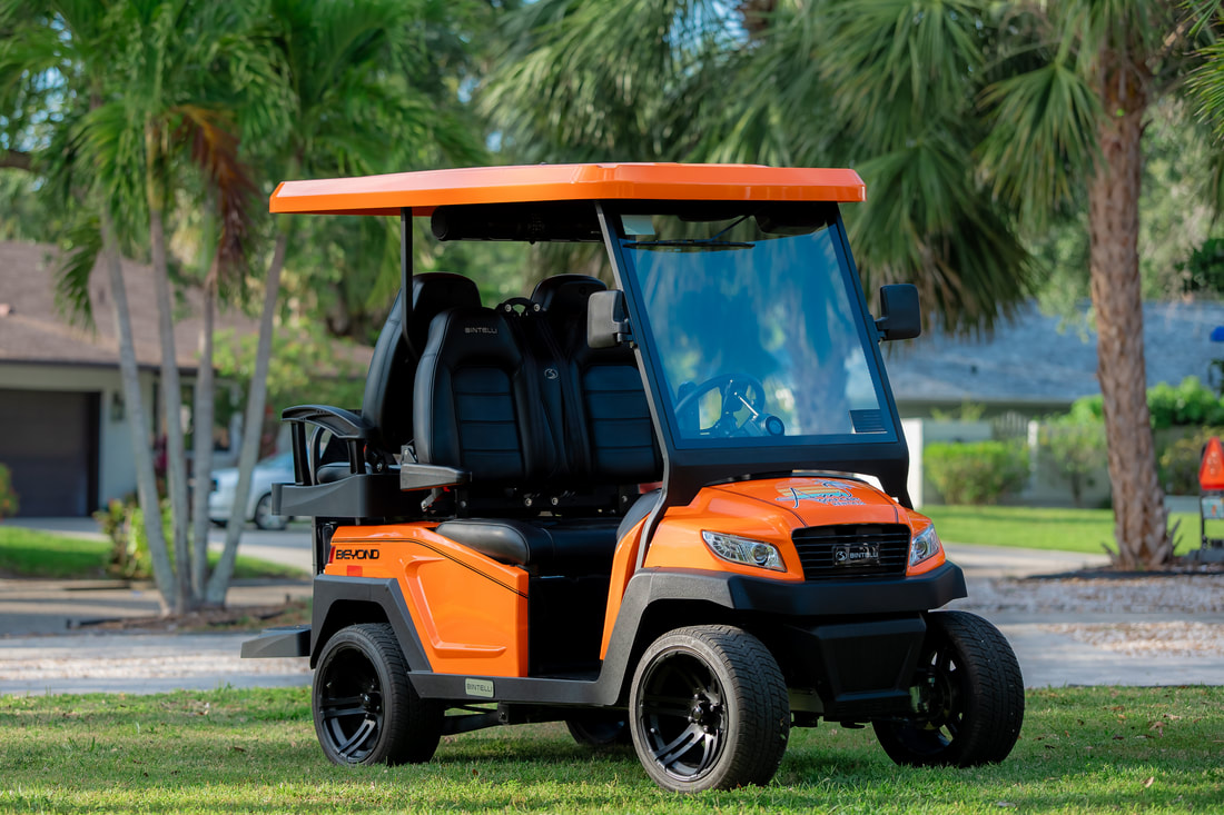 Red 4 & 6-seat Bintelli golf cart rental on Anna Maria Island