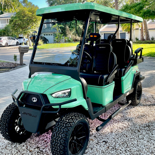 Green luxury 6-seat golf cart rental Anna Maria Island with rugged wheelsPicture