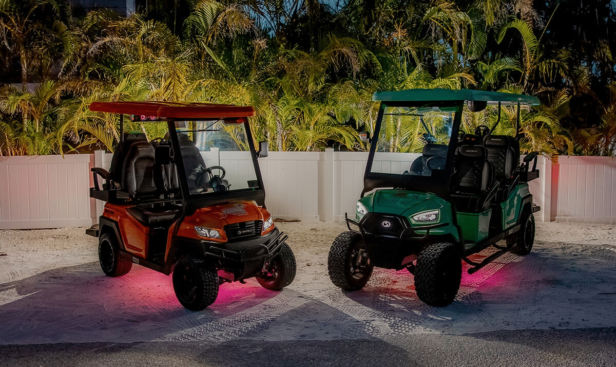 Anna Maria Island golf cart rentals featuring a 4-seat and 6-seat street-legal electric cart with colorful underglow lighting, perfect for family vacations.