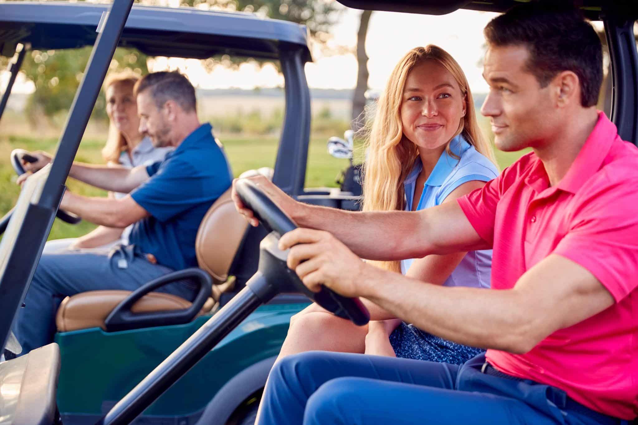 Mature couples enjoying an Anna Maria golf cart rental while exploring together on vacation.