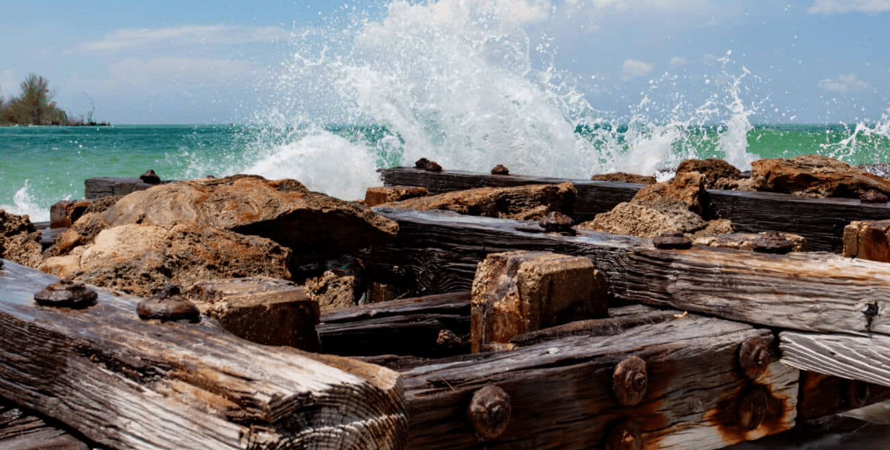 Turquoise Gulf waves crashing on Anna Maria Island shoreline. A perfect beach weather for exploring.